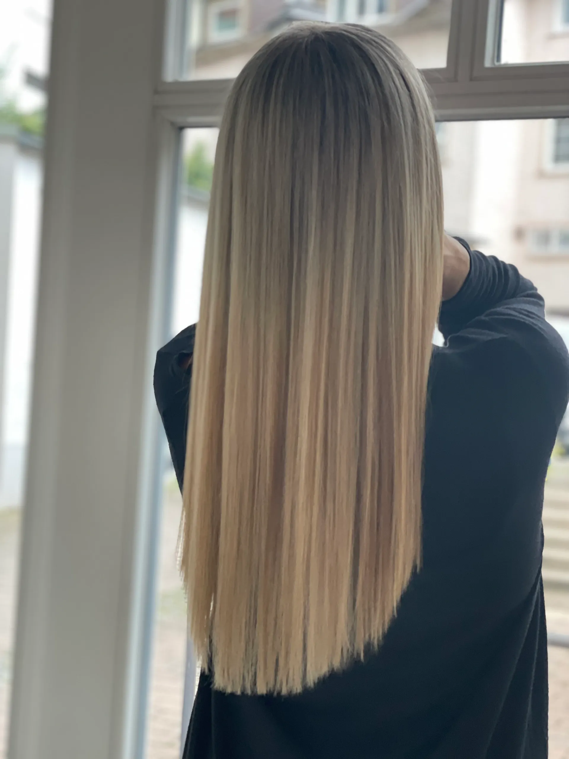 Beautiful long blonde balayage with perfect color and healthy shine